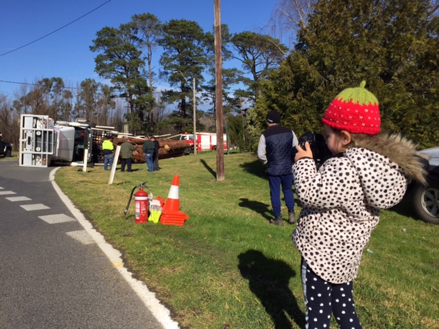 three year old photographer captures log truck rolled over in Healesville